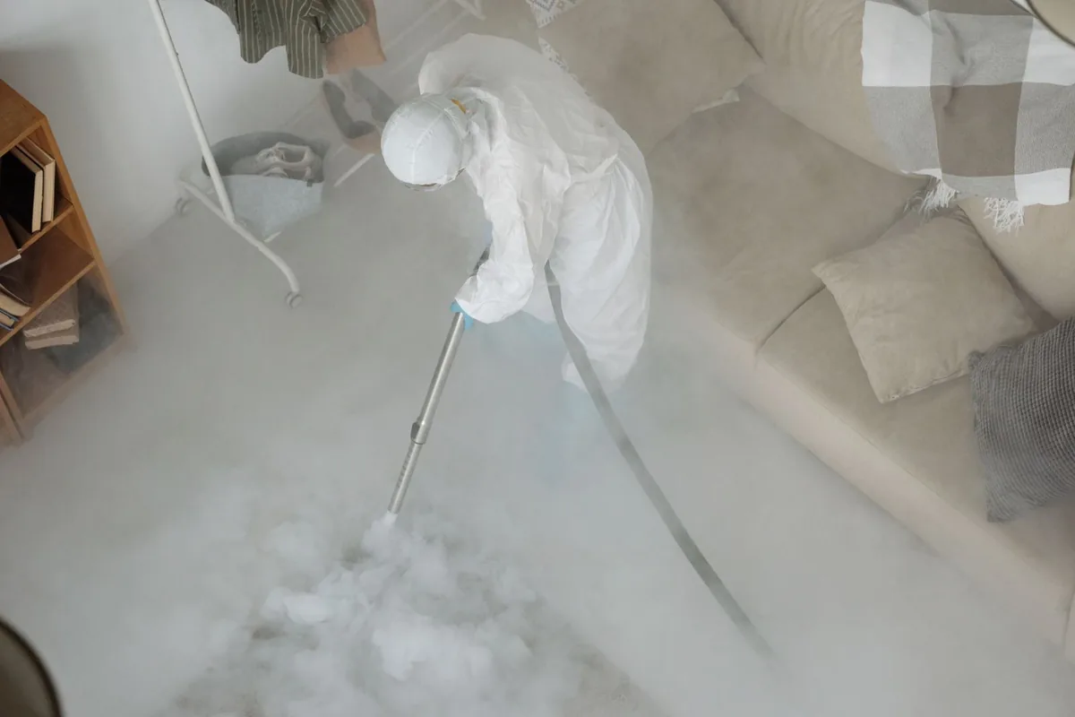 Biohazard cleanup technician in protective equipment, Nicholls, GA